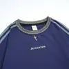 Jiangfu Comercio Exterior 2026 Verano Nuevo de Moda Fresco Camiseta Unisex de Manga Corta Suelta con Estampado de Tres Rayas Top Estilo Urbano