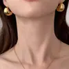 Aretes de Bola Dorada Semicírculo Grueso Forma de C Hueco Minimalista 2026 Nuevos Aretes de Esfera Irregular Aretes de Moda Tendencia para Mujeres