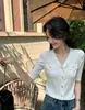 Top de punto estilo retro con mangas abullonadas, botones de perla multicolor, nueva camiseta base fina de verano con cuello en V, adelgazante para mujer