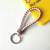 Llavero creativo de cuerda de cuero tejido a mano para pareja, llavero de coche, llavero al por mayor, colgante para bolso