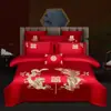 Juego de ropa de cama de lujo estilo chino, hecho de algodón 100% de fibra larga, un juego de cuatro piezas que incluye una sábana y una funda de edredón de algodón puro rojo, perfecto para la alcoba de una recién casada.