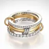 Anillo Sanjie Popular Transfronterizo de Tres Anillos Entrelazados Completamente Incrustado con Circonita de Diamante Joyería de Mano de Moda Multielemento de Dos Tonos y Tres Anillos Listo para la Venta