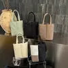 Bolsa para Garrafa de Água com Bloqueio de Cor Simples Bolsa de Mão Feminina 2026 Outono Nova Bolsa de Lona Nicho Ombro Único Bolsa Tote para o Dia a Dia