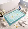 Tapete de banheiro pequeno estilo coreano com margaridas, adequado para uso doméstico, absorvente, resistente a manchas, fácil de limpar e apresenta um design de imitação de caxemira para fins decorativos.