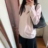 Camiseta Rosa Simple Coreana Reductora de Edad de Manga Larga para Mujer Primavera y Otoño 2025 Holgada Casual Versátil Top de Cuello Redondo