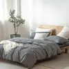 Juego de cuatro piezas de algodón 100% teñido en hilo y lavado, algodón puro, sin marca, suministrado por el fabricante, funda de edredón de alta calidad, sábana bajera de estilo japonés, ropa de cama al por mayor