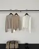Han Xun Elegante y Sereno Cardigan de Punto Holgado con Bolsillo Falso Cosido y Cuello en V Mezcla de Lana Colección Otoño 2026 27491
