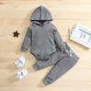 Ropa para niños nueva europea y americana de primavera y otoño para niños gofre color sólido con capucha pantalones largos de dos piezas