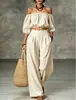 Conjunto casual de dos piezas para mujer 2026 estilo nuevo transfronterizo europeo y americano, con hombros descubiertos, mangas abullonadas, cintura alta y pierna ancha, color liso