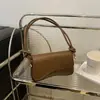 2025 Nuevo Estilo Bolso de Hombro Flip Simple de Moda para Viajes Diarios Bolso Cuadrado Pequeño Bolso de Mano Versátil para Mujeres Venta al por Mayor