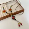 Collar Colgante de Cuerda Trenzada con Cuentas de Cerámica Nuevo Estilo Chino Retro Elegante Cadena para Clavícula Nicho Lujo Accesible Joyería Versátil para Mujer