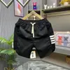 Shorts Casuais de Retalhos Listrados de Verão Marca da Moda Masculina Shorts de Cinco Pontos Largos de Perna Reta Calças de Praia de Secagem Rápida