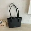 Bolso tote de gran capacidad minimalista de nicho de moda estilo coreano 2026 nuevo modelo bolso de hombro y cruzado de alta gama