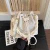 Bolso bandolera tipo cubo para mujer 2026 verano nuevo de alta gama lujo ligero moda nicho bolso de hombro trabajo bolso tote pequeño
