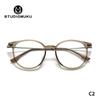 Gafas de madera STUDIOMUKU con montura redonda sencilla y diseño único, transparentes y con montura degradada.