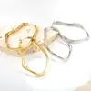 Brincos de Aço Inoxidável com Design de Abertura Redonda Vazada, Sentido de Alto Padrão da Moda Francesa Transfronteiriça, Design de Nicho de Luxo Leve, Atacado