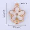 Colgante Creativo de Flor de Cerezo de Venta Caliente Transfronteriza Materiales para Accesorios DIY Aleación de Metal con Goteo de Aceite Pulsera Doble Colgante Collar Pendientes Colgantes