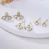 2025 nuevo Saturno perla exquisito microincrustación circón clavo de cartílago de oreja moda pequeño Joker alto sentido venta directa de fábrica