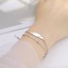 Pulsera de acero inoxidable para mujer, con colgante de pluma de doble agujero, cadena de cuentas dobles apiladas de acero de titanio simple, de moda europea y americana