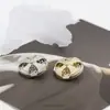 Botón de Abrigo Metálico con Diamante de Diseño Exclusivo de Molino de Viento Hueco para Suéter de Piel para Mujer Botón Decorativo Redondo