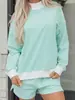Traje casual holgado de tendencia de moda europea y americana para mujer, nuevo conjunto de dos piezas a rayas de manga larga para invierno 2025 para mujer