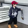 Elegante chaqueta de otoño para niño 2026 nuevo modelo, chaqueta de béisbol de motocicleta para bebé, chaqueta moderna de primavera y otoño para niños