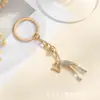 Accesorios Colgantes Llavero Estilo Deportivo Transfronterizo Europeo y Americano Forma de Niña Linda