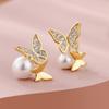 Cao Shi tiembla con aretes de temperamento de lazo versión coreana de los nuevos aretes asimétricos de perlas de imitación una generación de cabello