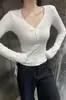 Ropa de mujer de moda estilo coreano para otoño e invierno 2026: nueva camiseta de manga larga con botones y cuello en V estilo coreano, corte ajustado