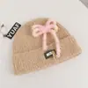 Gorro de punto estilo coreano de mezcla de lana inspirado en la dopamina con un lazo, un gorro de invierno cálido y protector para las orejas para mujer, adecuado para estudiantes