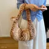 Bolso de gran capacidad para el día a día 2026 nuevo moda otoño e invierno felpa estampado de leopardo bolso de hombro casual para mujer bolsa de albóndiga versátil