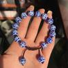 Venta al por mayor de fábrica Pulsera de joyería con cordón trenzado de cuentas redondas de calcedonia azul Tianzhu cara brillante Xizang Tianzhu A
