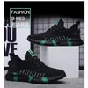 Otoño 2026 Nuevo Elástico Flyknit Transpirable Malla Negra Zapatos Casuales Suela Suave Ligeros Cómodos Tenis F99