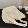 Bolsa de ombro feminina casual de grande capacidade em tecido, nova bolsa de palha vazada, bolsa de praia casual estilo estudante