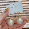 Elegantes y a la moda aretes colgantes de perla estilo coreano, con un diseño único y estiloso, perfectos para el uso diario y para complementar cualquier atuendo.