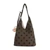 Bolso de axila de lunares con diseño de nicho estilo coreano, bolso de tela elegante y casual, bolso de hombro de alta apariencia para commuting para mujer