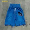 Pantalones de chándal para hombre hechos a medida con retazos de color contrastante, con dobladillo deshilachado y estampado de corazón, modernos y de corte holgado