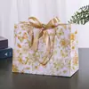 Sacolas de presente transfronteiriças, sacolas de papel coloridas, sacolas de embalagem transfronteiriças com fitas, sacolas de presente de feriado, sacolas de compras para roupas