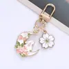 Ins Flor de Cerejeira Coelho da Lua Fofo Rosa Metal Chaveiro Casal Presente Masculino e Feminino Pequeno Pingente Decoração de Bolsa