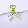 Llavero colgante de lazo estampado de estilo creativo y fresco con decoración de hebilla de puerta hueca en forma de corazón para DIY
