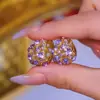 Brincos brancos elegantes e luxuosos de 2024 com zircônia roxa e explosões da moda, brincos atmosféricos elegantes