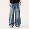 Pantalones de mezclilla estilo americano, de calle, geniales y atrevidos para hombre, con diseño de salpicaduras de tinta, corte holgado y estilo de pierna ancha, una nueva tendencia de la colección Otoño 2026