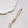 Correa de Muñeca Trenzada Estilo Ins Lanyard Nudado Cuerda Corta de Silicona Colgante Antiperdida para Teléfono Dopamina