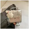 Mochila de lunares de moda para mujer, primavera temprana 2026, estilo coreano, bolso de hombro cruzado simple de nicho