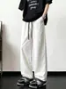 Pantalones casuales versátiles de moda para hombre, nuevo modelo 2026, diseño de cuadros patchwork, elegantes pantalones rectos holgados con cordón para hombre