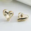 Pendientes de estrella de la moda coreana para mujer diseño de alta gama sentido del diseño pendientes con forma de corazón lujo ligero temperamento pendientes geométricos clip para la oreja venta al por mayor