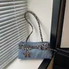 Bolso coreano de nicho con estampado de leopardo 2026, bolso de hombro tipo tote de motorista con bloques de color y decoración de cinturón, bolso de mano elegante y versátil para mujer