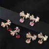 Pendientes de Tachuela de Circonita con Lazo Multicolor Temperamento Elegante de Gama Alta Azúcar Cubo Circonita Pendientes Coloridos de Comercio Exterior
