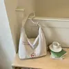 Bolsa de lona estilo coreano de gran capacidad Shuai Mijia para mujer, nueva bolsa simple a rayas de verano 2026, bolsa de mano para estudiantes para la clase