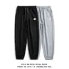 Pantalones de hombre al por mayor, modernos y versátiles, pantalones deportivos tipo jogger para primavera y verano, pantalones largos casuales de gofre holgados para hombre